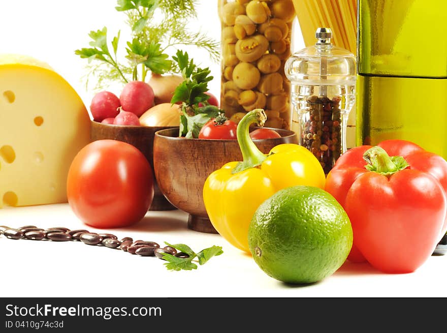 Vegetables , pasta, cheese and different spice,  on a white background. Vegetables , pasta, cheese and different spice,  on a white background