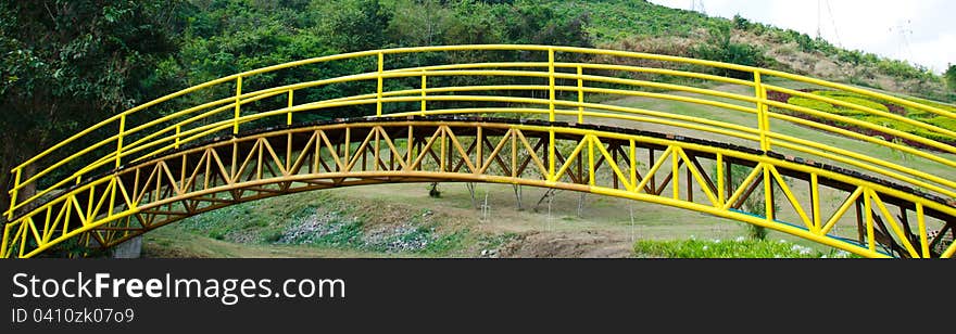 Yellow iron bridge in the park. Yellow iron bridge in the park.