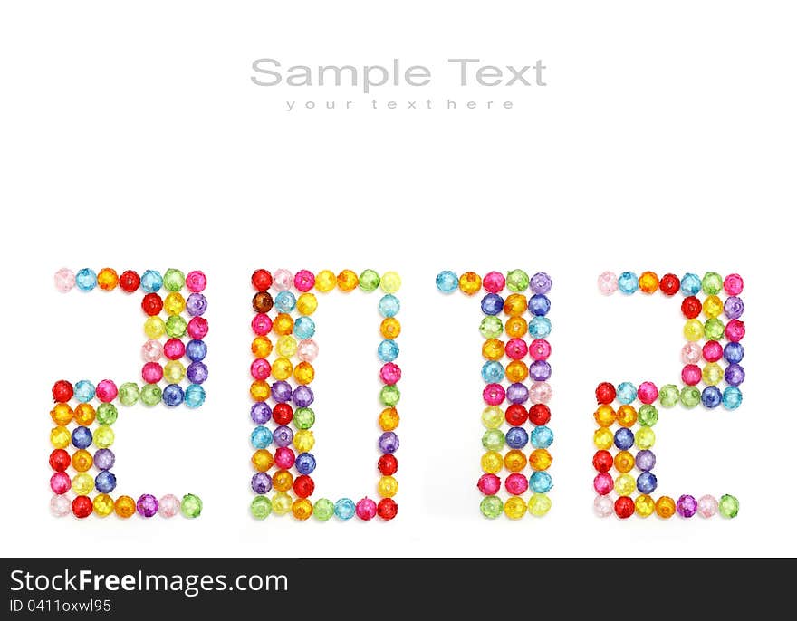 2012 made of colorful beads on white background