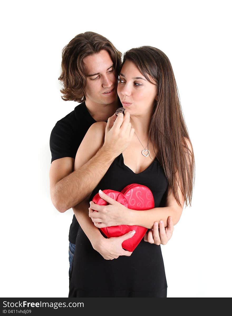 Pretty Brunette With her handsome guy being fed Chocolates. Pretty Brunette With her handsome guy being fed Chocolates