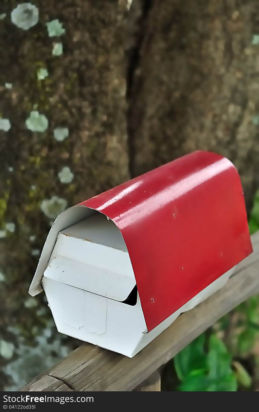 A post box in white and red