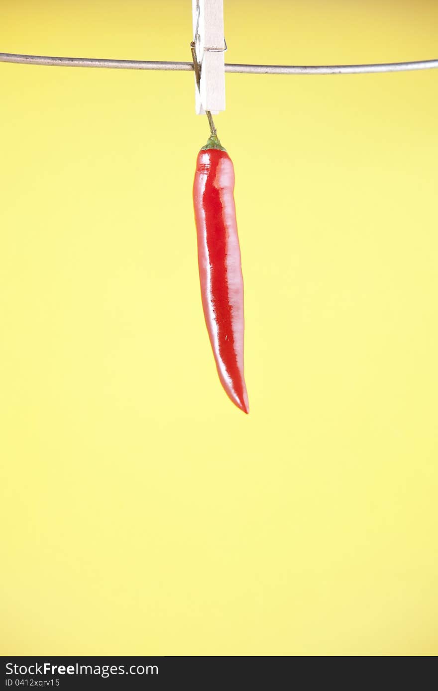 Red pepper hanging on a clothespin. Red pepper hanging on a clothespin