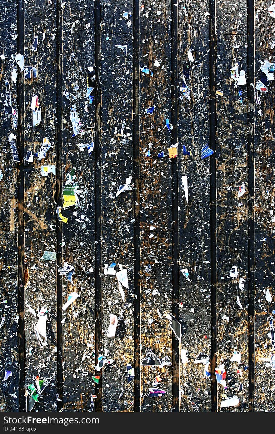 A heavily used notice board is full of stapler pins and remains of old advertizements. A heavily used notice board is full of stapler pins and remains of old advertizements.