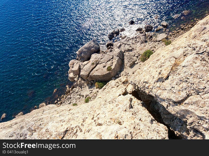 Crack in the rock, sea ​​view from mountain