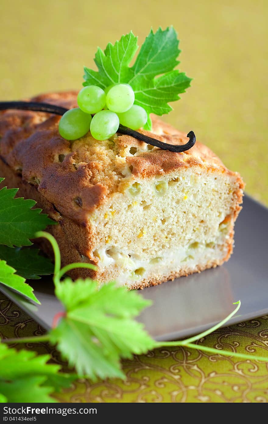 Grapes, lemon and vanilla cake, selective focus. Grapes, lemon and vanilla cake, selective focus