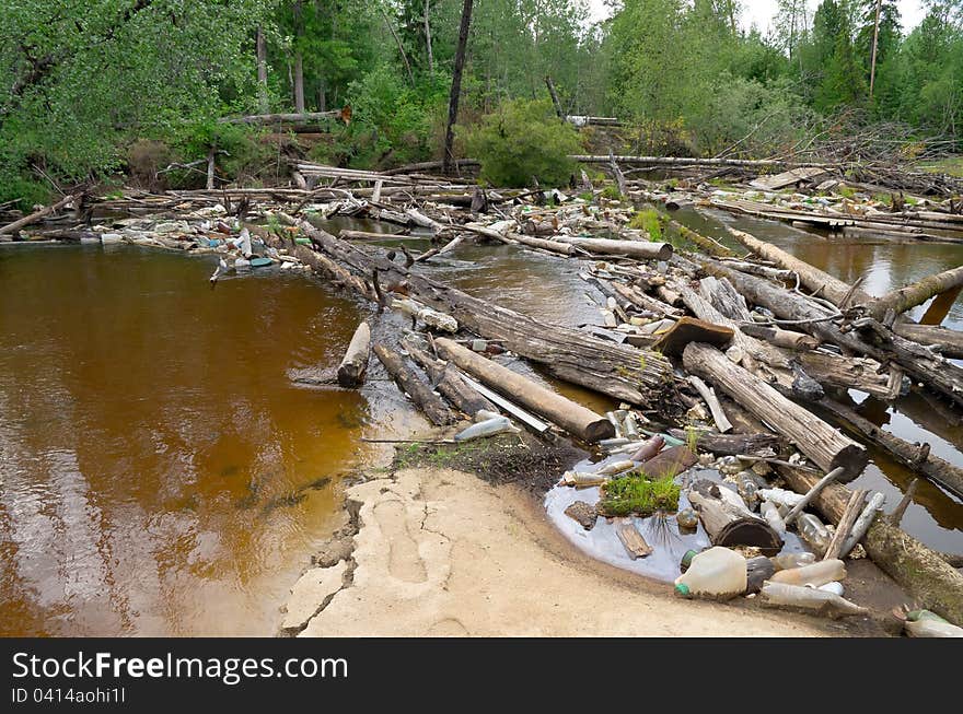 Jam from garbage and old trees on river in Western Siberia. Jam from garbage and old trees on river in Western Siberia.