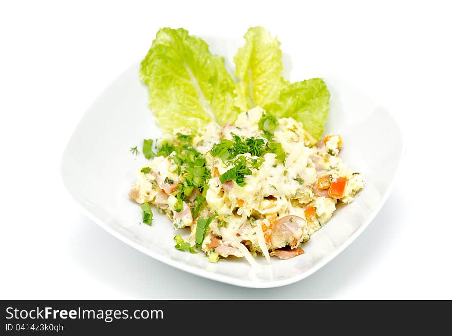 Salad with cheese, pepper, meat, spices and greens