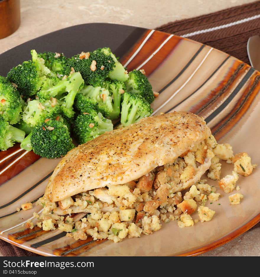 Baked stuffed chicken breast and broccoli dinner