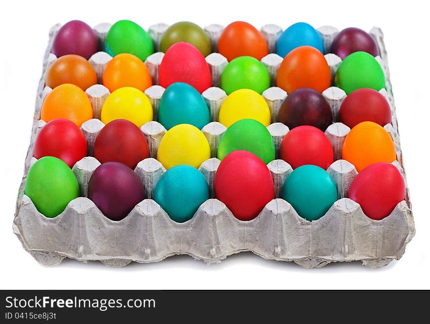 Colorful easter eggs in carton  on white background