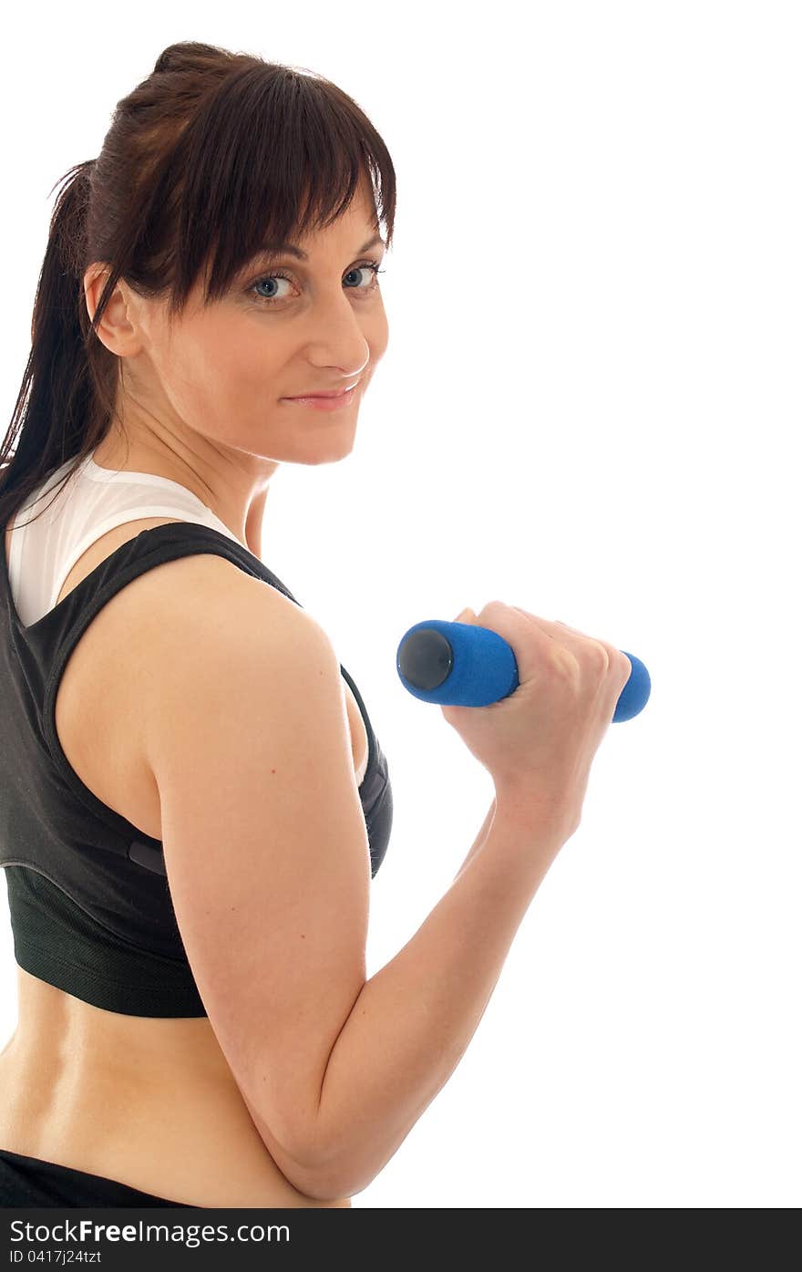 Woman is training with weights in a gym