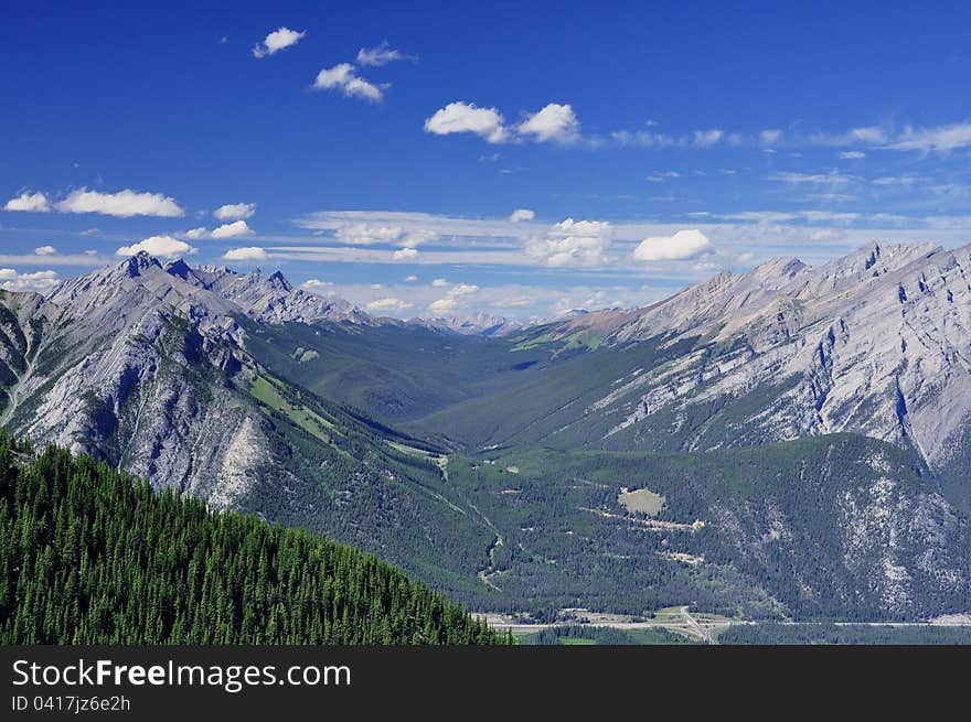 A beautiful mountain vista greets vacationers as they walk on the clouds. A beautiful mountain vista greets vacationers as they walk on the clouds.