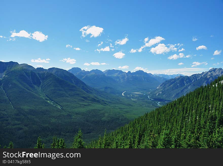 A beautiful mountain vista greets vacationers as they walk on the clouds. A beautiful mountain vista greets vacationers as they walk on the clouds.