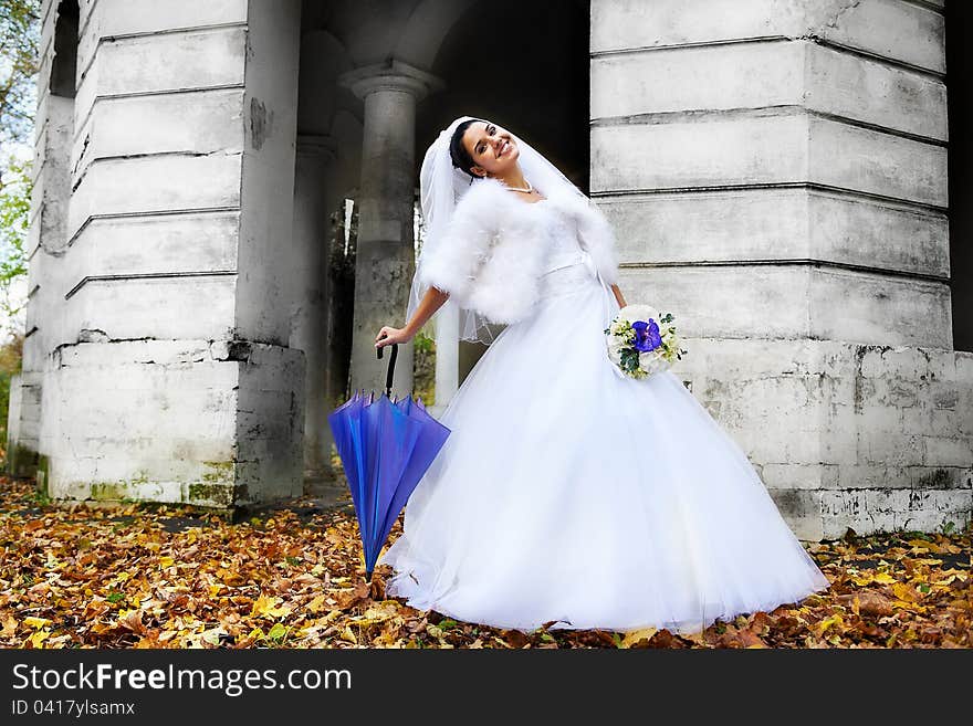 Beautiful bride with umbrella