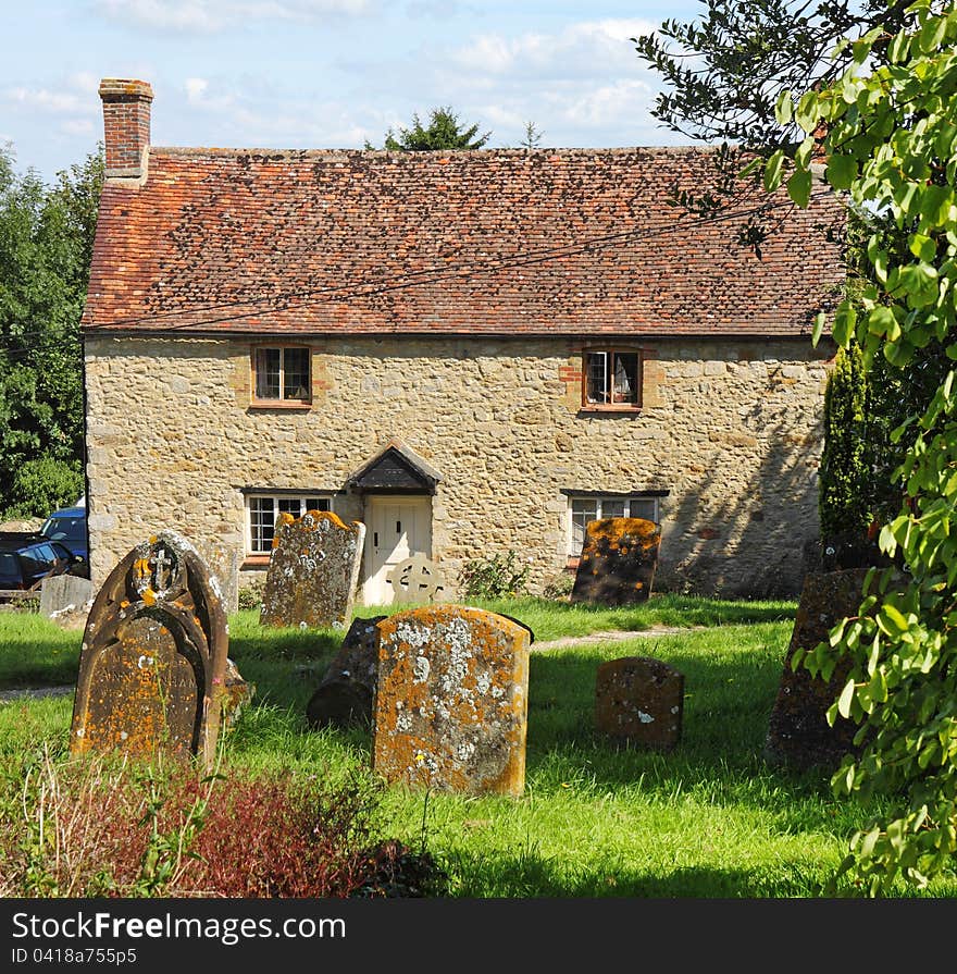 Traditional English Village Cottage viewed from the graveyard