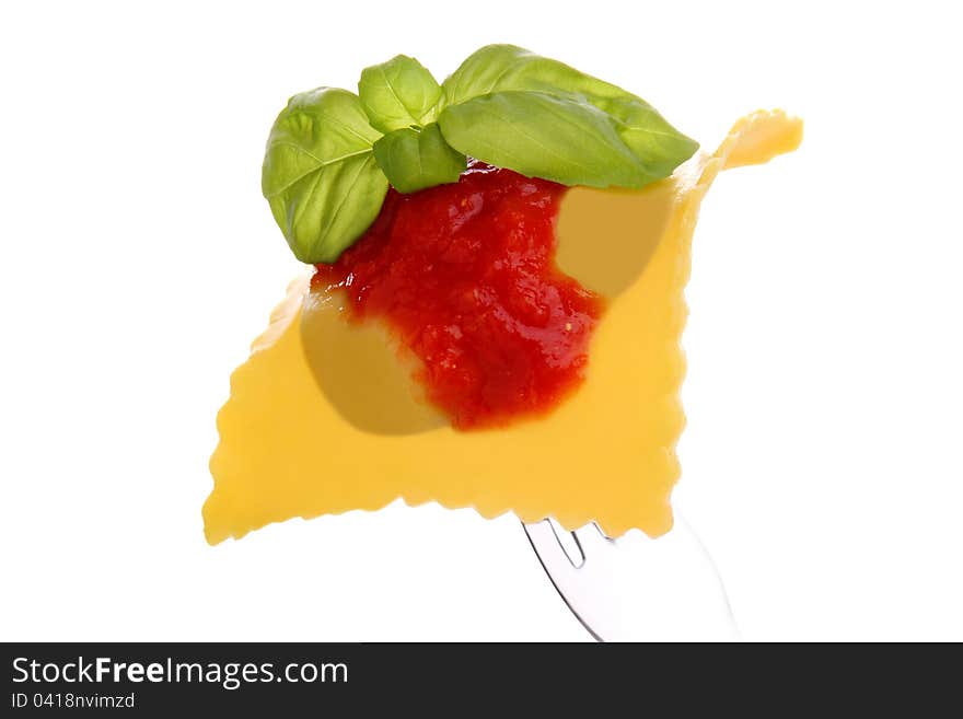 Ravioli whit tomato end basil on the white background. Ravioli whit tomato end basil on the white background