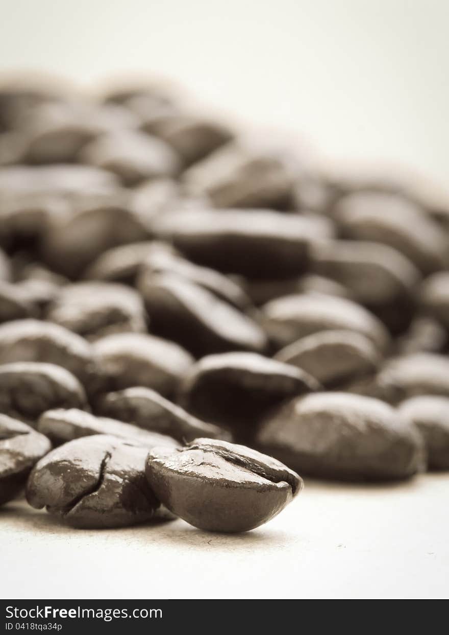 Coffee beans on cardboard, in sepia