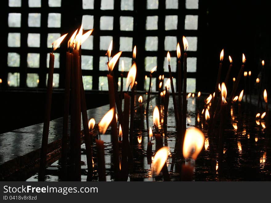 Lit candles in the church. Lit candles in the church