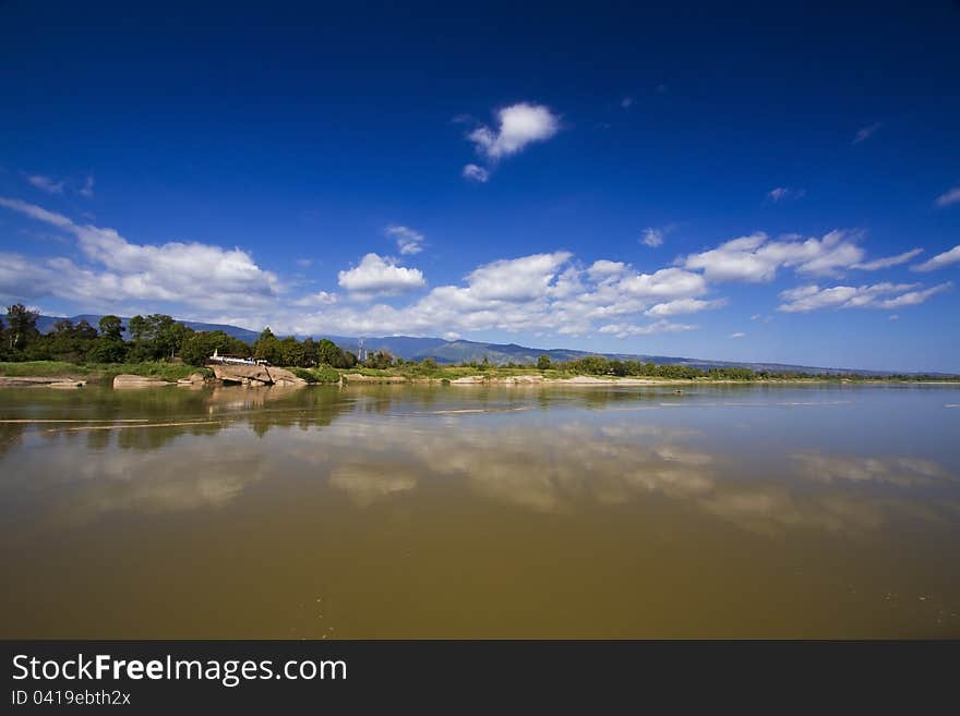 Reflection of a cloud over river. Reflection of a cloud over river.