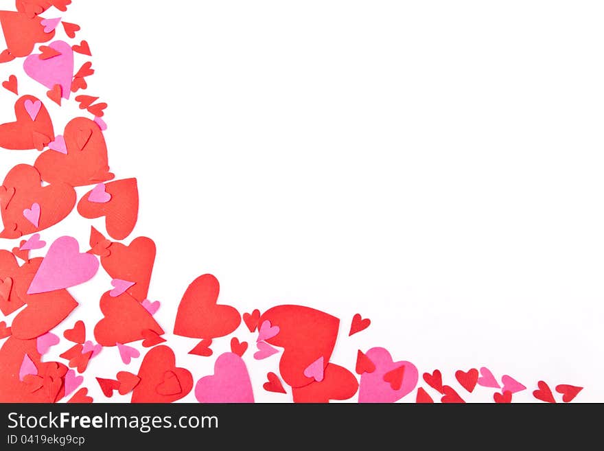 Red and Pink Confetti shaped like hearts set on a white background with copy space. Red and Pink Confetti shaped like hearts set on a white background with copy space