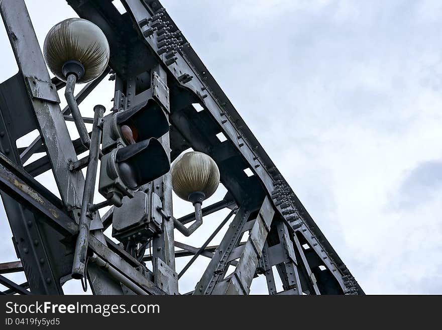 Traffic light and lamps on old bridge, Bratislava