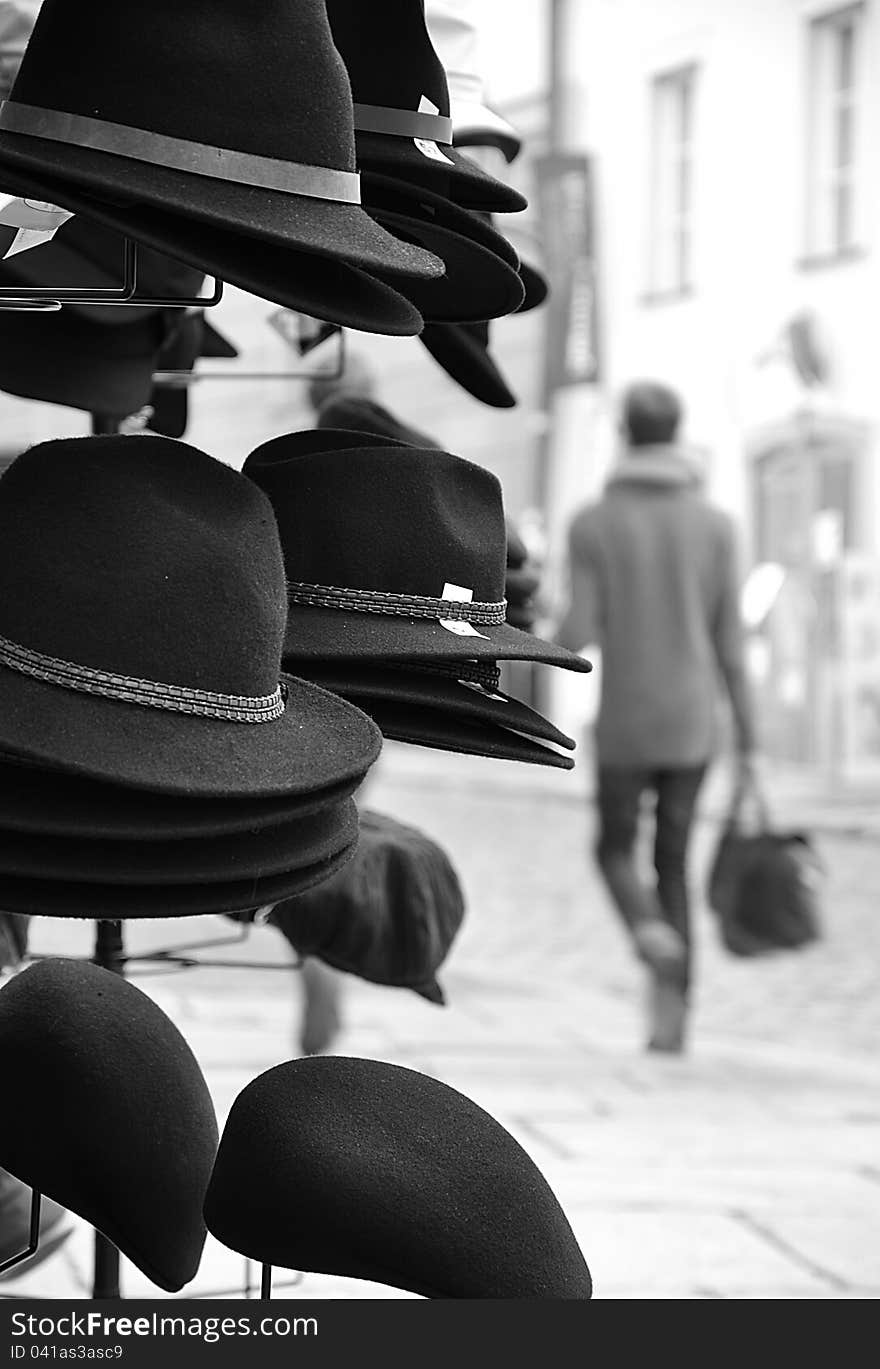 Hats for sale placed in a busy street