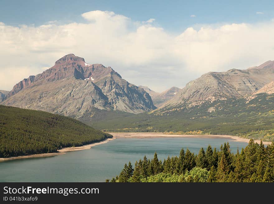 Mountain, Lake and Clouds at Glacier National Park. Mountain, Lake and Clouds at Glacier National Park