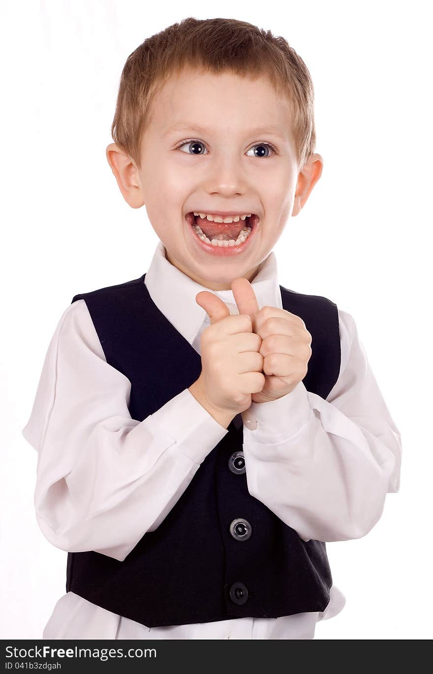 Happy boy shows the sign OK on a white background