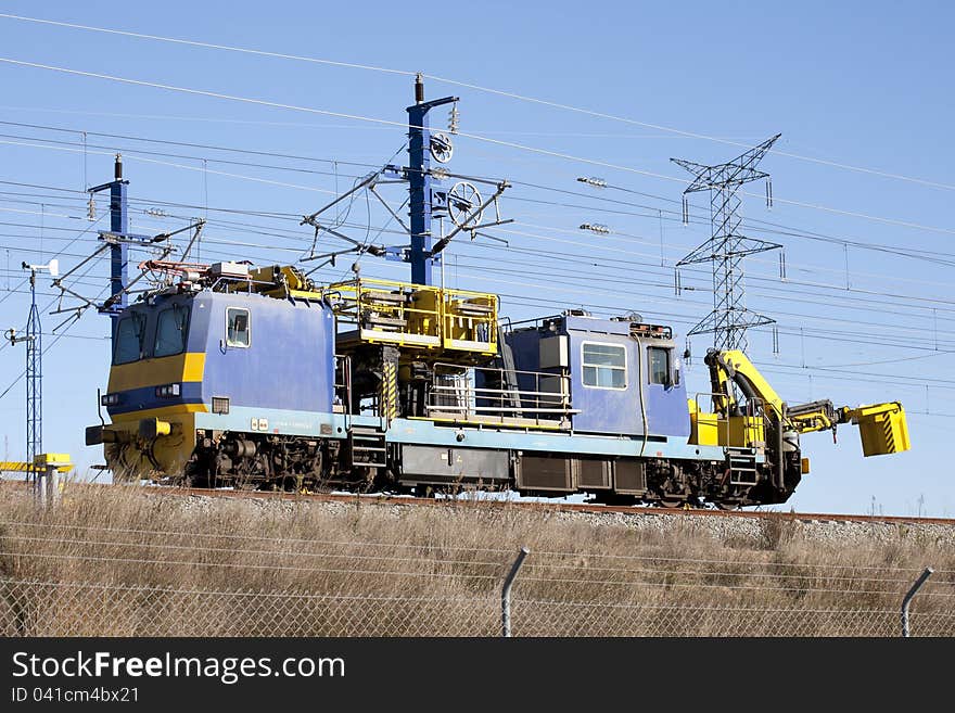 Machine repairing railway catenary via the AVE in. Machine repairing railway catenary via the AVE in