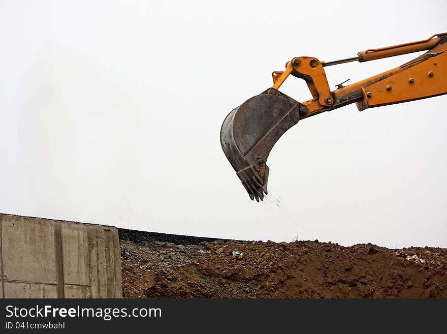 Excavator Loader with backhoe rised standing on earth