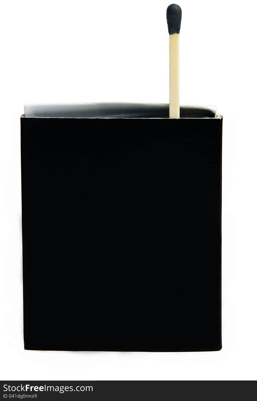 Black matches box and one match