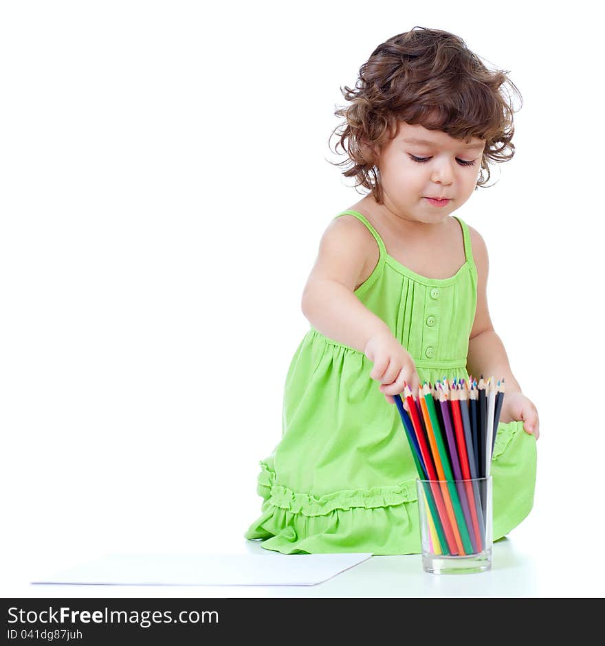 Little Girl Drawing With  Pencils