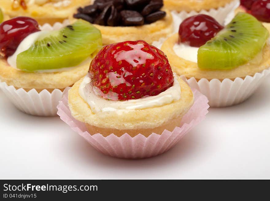 Strawberry, cherry, kiwi, and chocolate cupcake