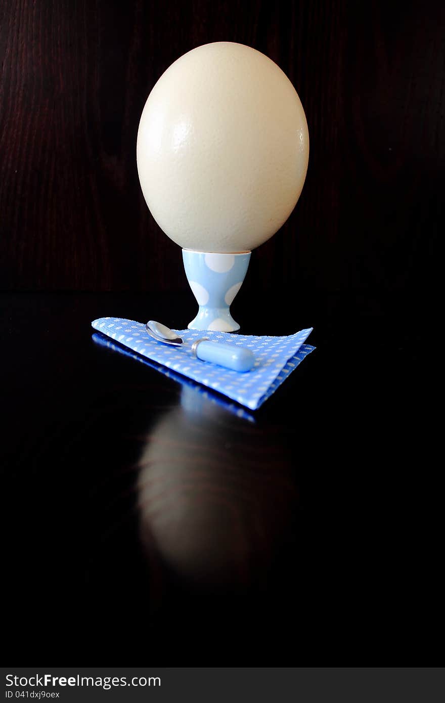 Ostrich egg in an egg cup. Ostrich egg in an egg cup