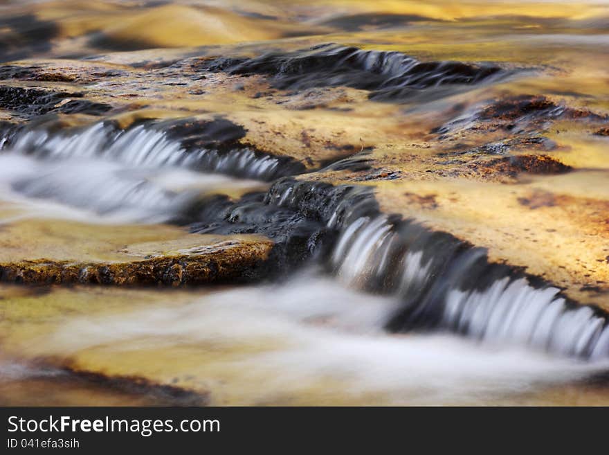 Beautiful stream flowing in late afternoon sun