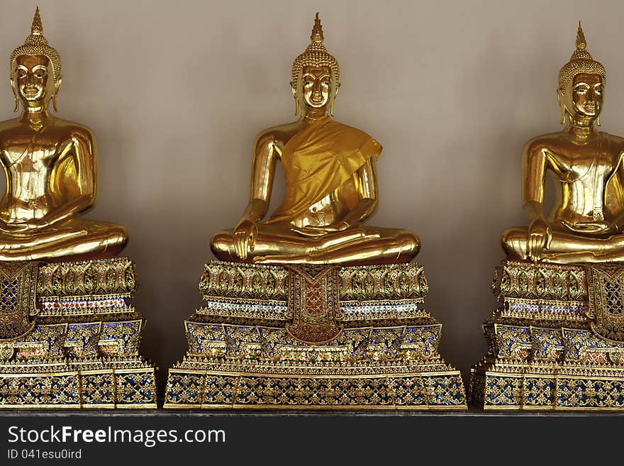 Golden Buddhas At Temple In Thailand.