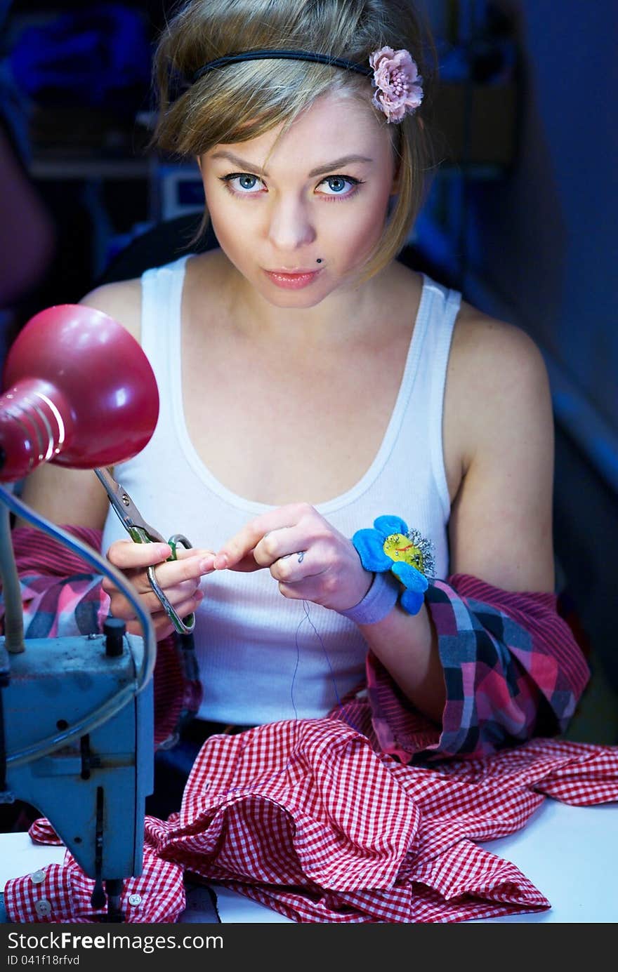 Seductive Blond Sewing In Her Workshop