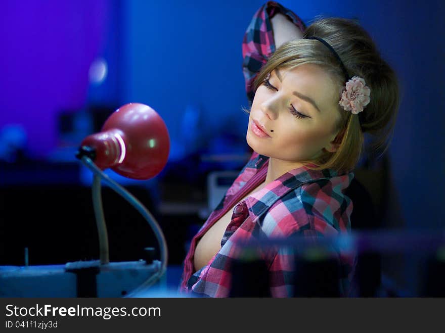 Seductive Blond Sewing In Her Workshop