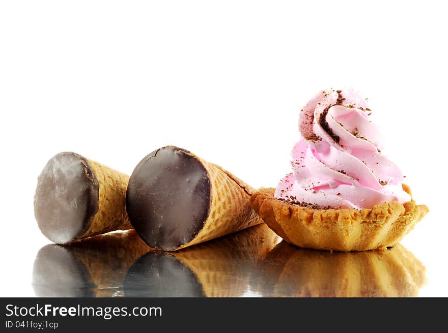 Chocolate sweets and cupcake,  on a white background