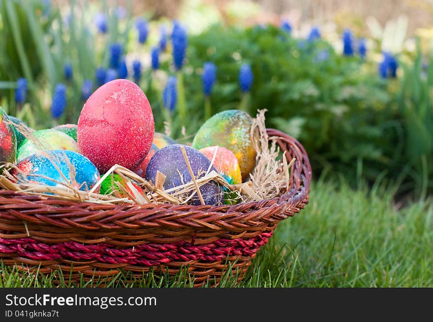 Easter eggs in brown pannie on the grass. Easter eggs in brown pannie on the grass