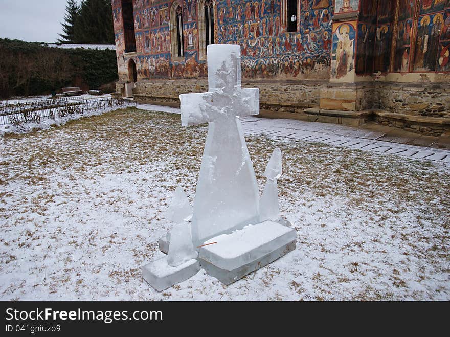 Winter season in Bucovina, view over an ice cross in the garden of the Modovita's garden, Romania. Winter season in Bucovina, view over an ice cross in the garden of the Modovita's garden, Romania