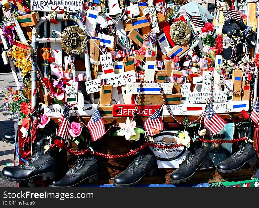 A stall sells the items of patriotic nature, like flags and soldiers' shoes. A stall sells the items of patriotic nature, like flags and soldiers' shoes.