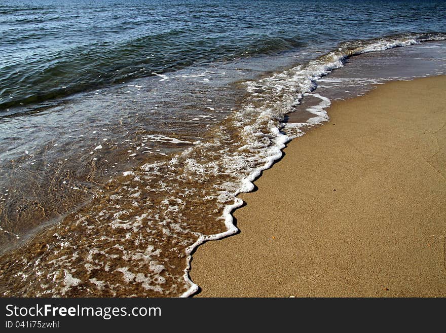 Beautiful blue ocean waves and golden sand. Beautiful blue ocean waves and golden sand