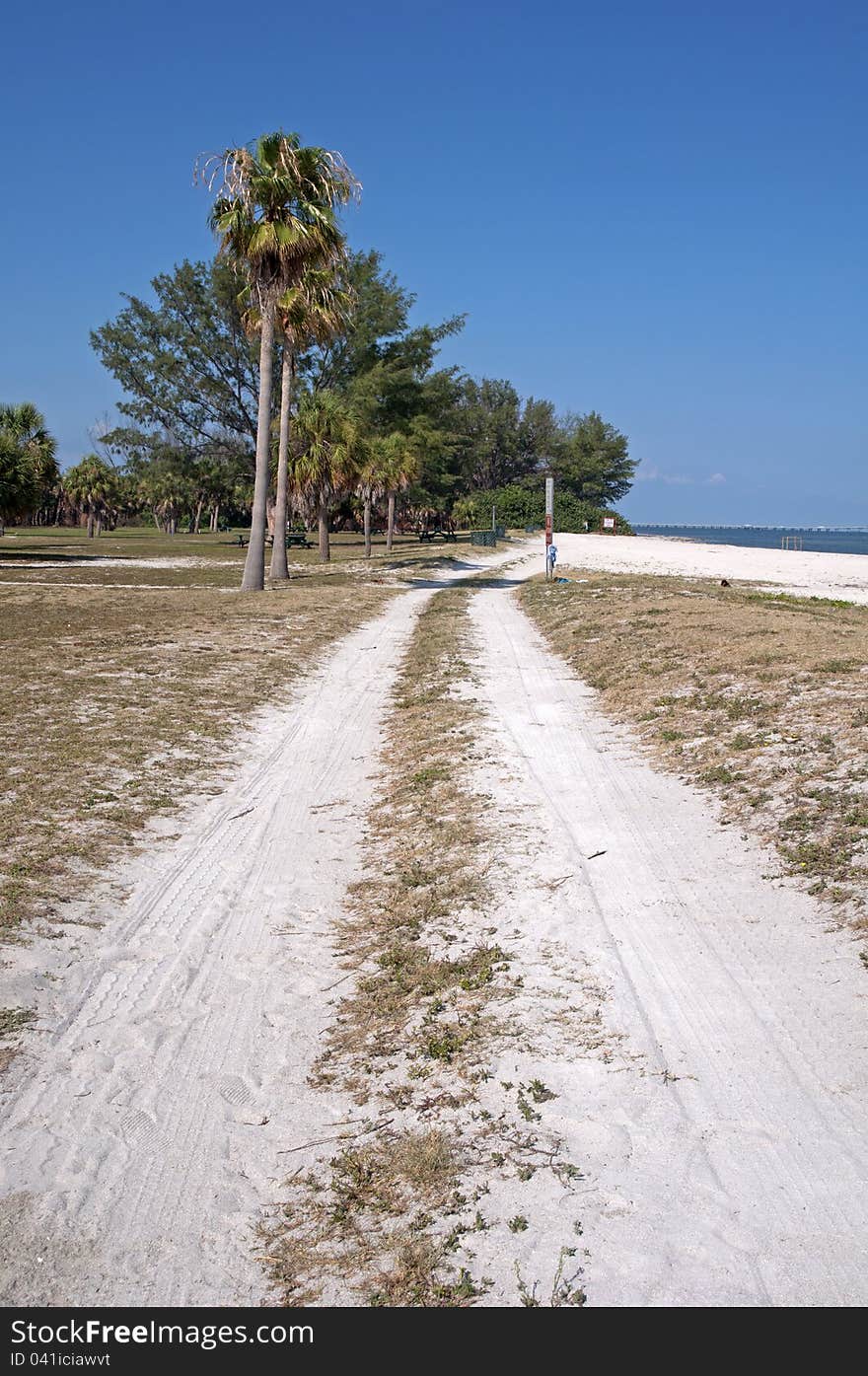 Dirt road alongside a beach