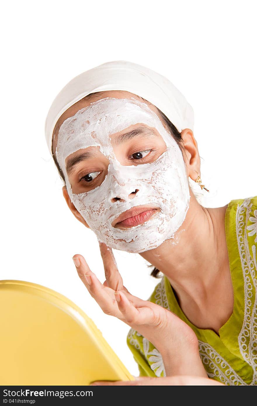 Indian woman with cosmetic mask