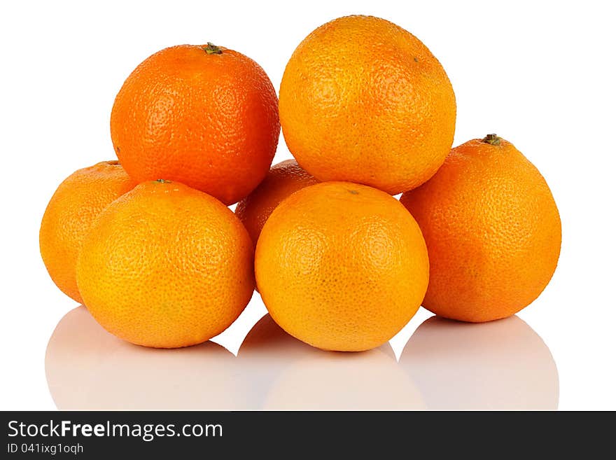 Seven fresh ripe mandarin oranges on a white background. Seven fresh ripe mandarin oranges on a white background.