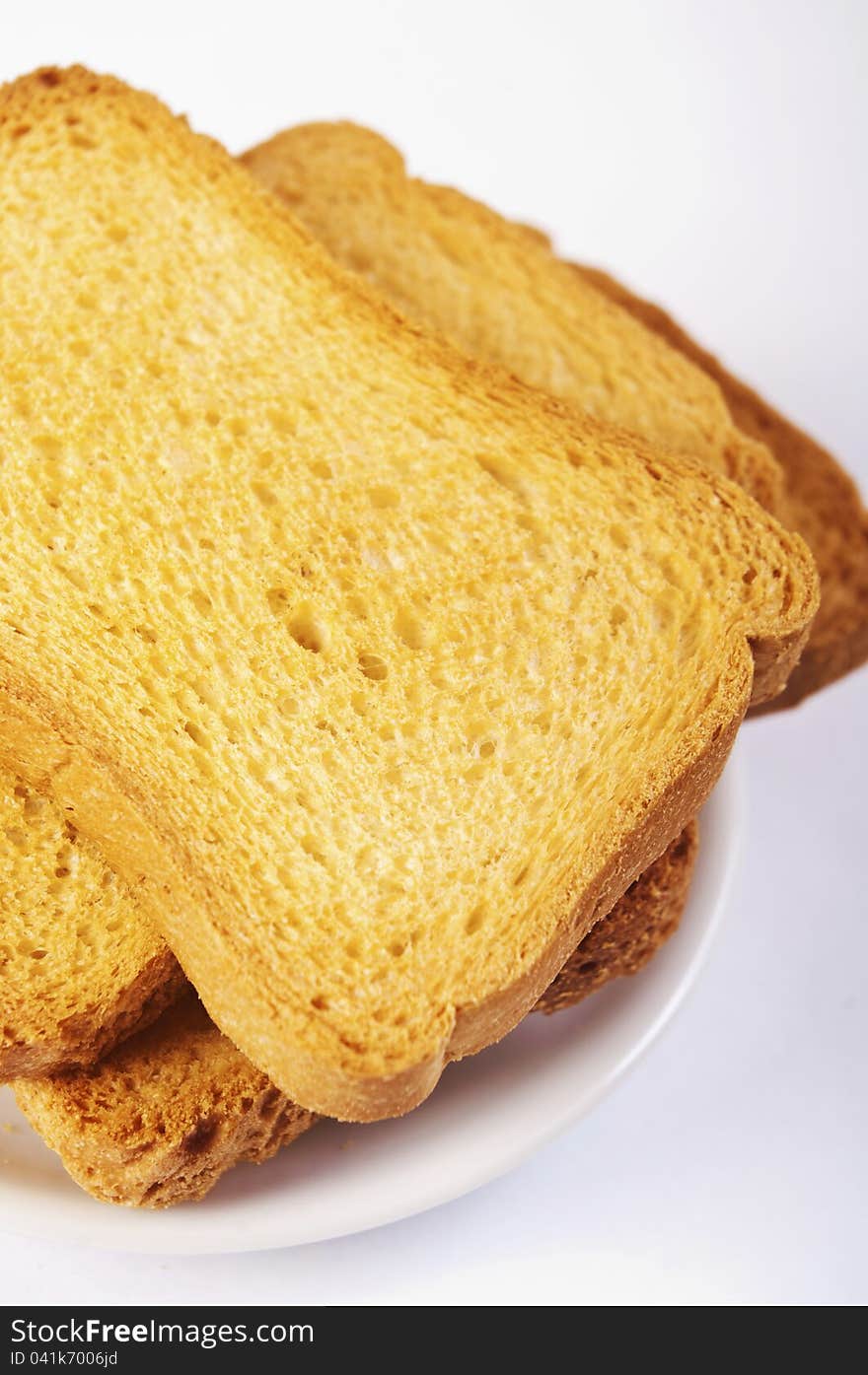 Toasted bread slices for breakfast isolated on white studio background.