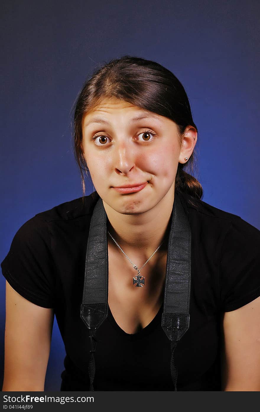 Freaky clown face girl isolated on blue