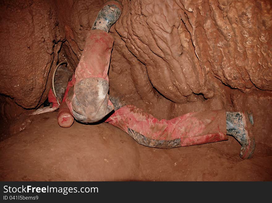 Cave passage with a caver in the underground