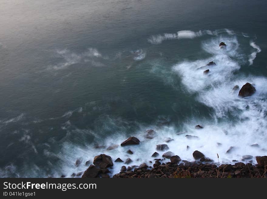 Smoth ocean water at the stones