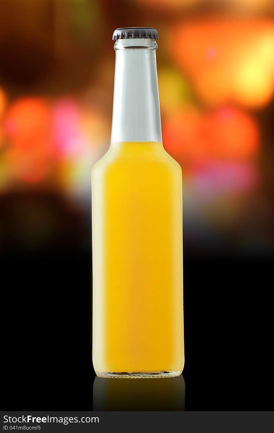 Orange cocktail on the background of a variety of colors